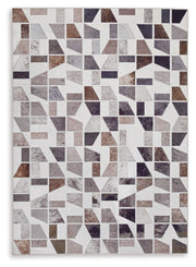 Signature Design by Ashley Jettner area rug with a geometric pattern, featuring neutral tones and soft texture for living room decor.