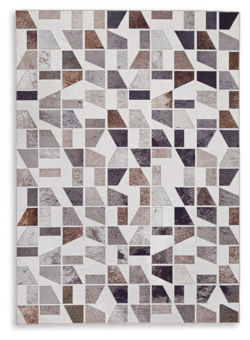 Signature Design by Ashley Jettner area rug with a geometric pattern, featuring neutral tones and soft texture for living room decor.