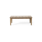 Noble House outdoor coffee table with light brown slat panel top, sturdy wooden design for patio or garden use.