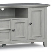 Simpli-Home Amherst wide TV media stand with open shelving and storage cabinets, made of wood in a modern design.