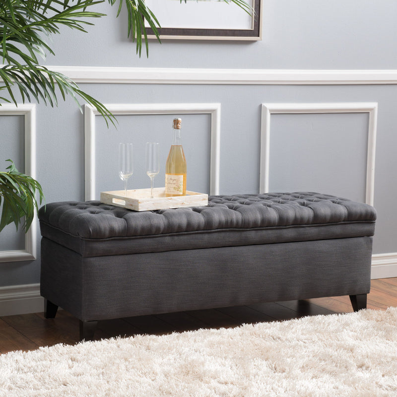 Noble House Juliana storage ottoman with birch wood legs, upholstered in neutral fabric, designed for living room or bedroom storage.
