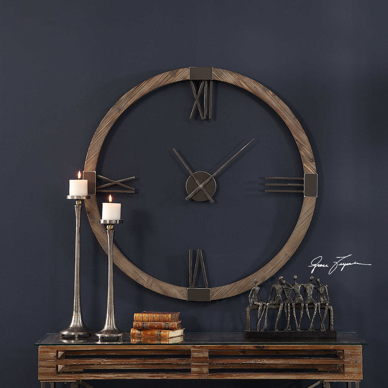 Uttermost Marcelo modern wall clock with light brown finish, round face, and minimalist design for contemporary home decor.