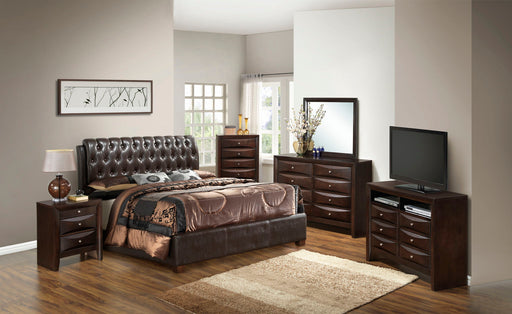 Glory Furniture tufted upholstered bed with a padded headboard and sleek design, showcasing a modern bedroom setup.