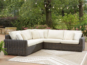 Signature Design by Ashley Kimora outdoor sectional featuring plush cushions and a modern stationary sectional design for outdoor lounging.