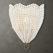 Uttermost Biddeford 1-light beaded sconce with gold finish and white accents, featuring elegant beaded detailing on the wall-mounted fixture.