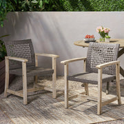 Set of two Noble House outdoor dining chairs with acacia wood frames, featuring slatted seats and armrests for patio dining.
