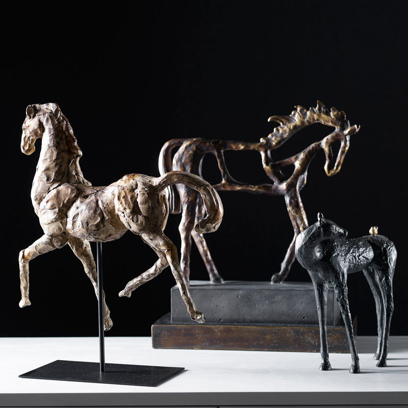 Gold horse sculpture by Uttermost, detailed dorado horse figurine with intricate craftsmanship on a sleek base.