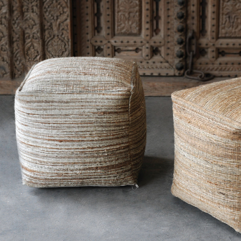 Uttermost Shiro beige accent pouf with round, plush fabric design, versatile for living room or bedroom decor.