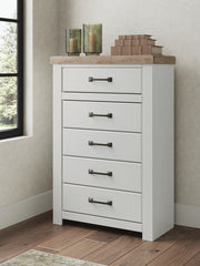 Benchcraft® Savonport five-drawer accent chest in white and brown with sleek handles and spacious storage drawers.