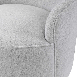 Gray Hobart casual swivel chair by Uttermost featuring a modern design and comfortable seating with a rounded back.