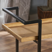 Modern industrial Noble House bar cart with shelving and casters, featuring a sleek design for mobile beverage storage.