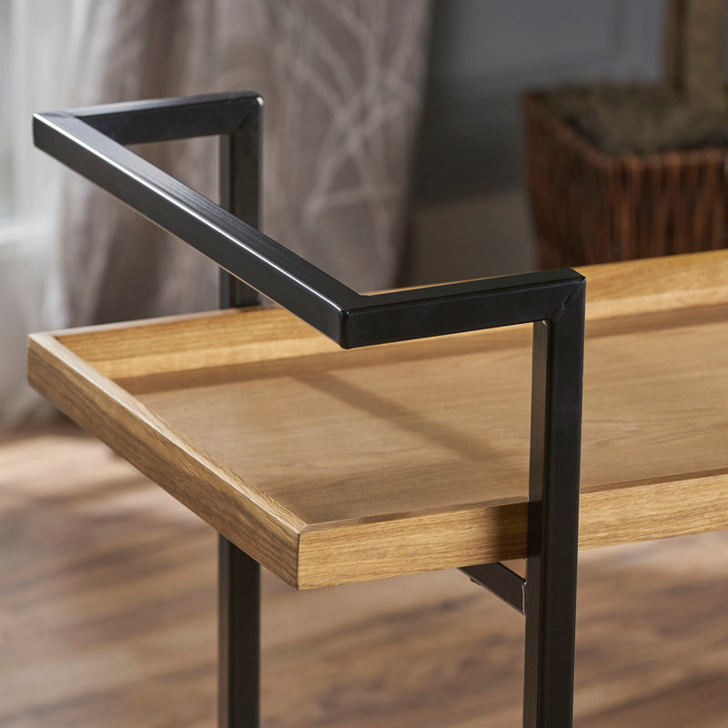 Modern industrial Noble House bar cart with shelving and casters, featuring a sleek design for mobile beverage storage.