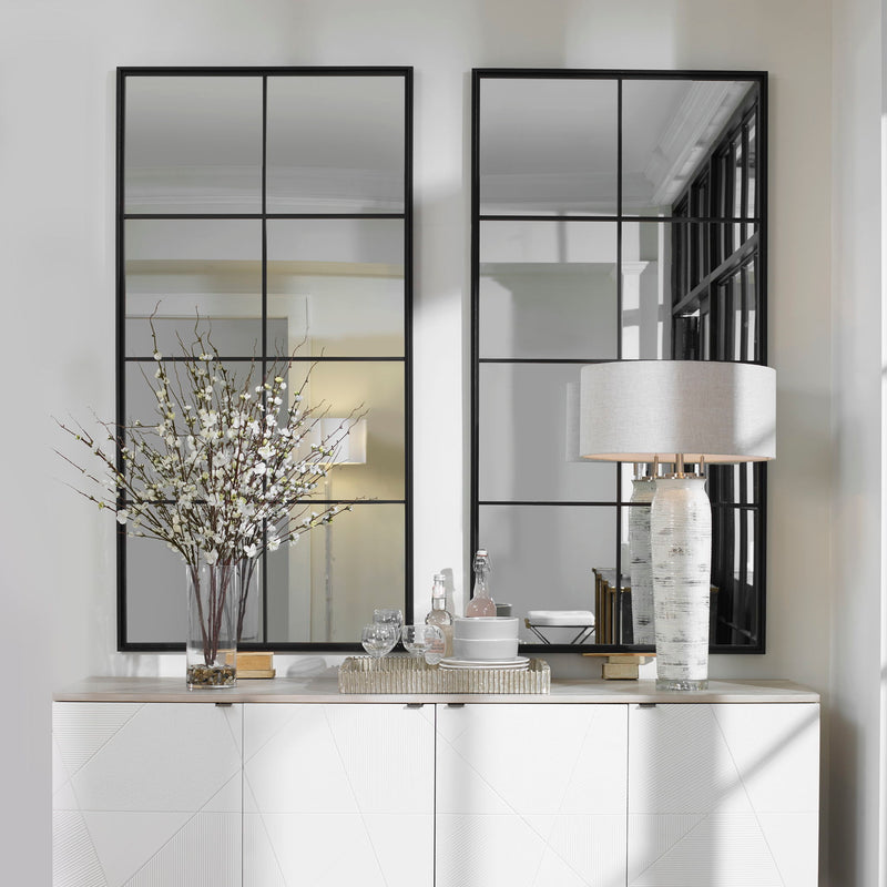 Black iron window mirror by Uttermost, featuring a vintage-inspired accent mirror design with a grid pattern and decorative frame.