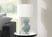 Modern 8th Street table lamp with a sleek design, featuring a neutral shade and a sturdy base for contemporary home decor.