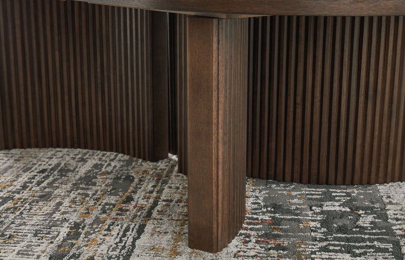 Korestone - Oval Cocktail Table - Dark Brown - R&R Furniture Gallery (Fountain Valley, CA)