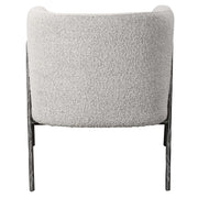 Uttermost Jacobsen accent chair with plush beige upholstery and sleek wooden legs, stylish modern seating for living rooms.