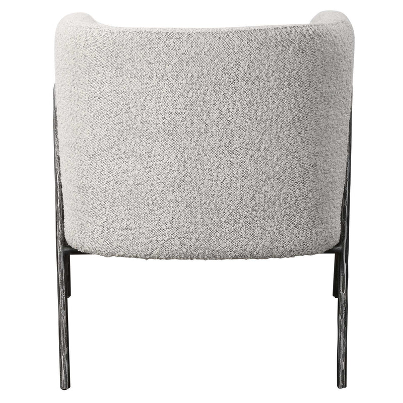 Uttermost Jacobsen accent chair with plush beige upholstery and sleek wooden legs, stylish modern seating for living rooms.