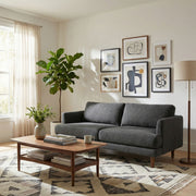 Livingston upholstered stationary sofa by Simpli-Home with plush fabric and wide armrests in a modern living room setting.