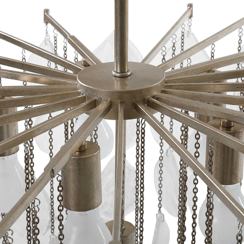 Uttermost Goccia tear drop glass pendant light hanging with a sleek metal fixture and clear glass teardrop shape.