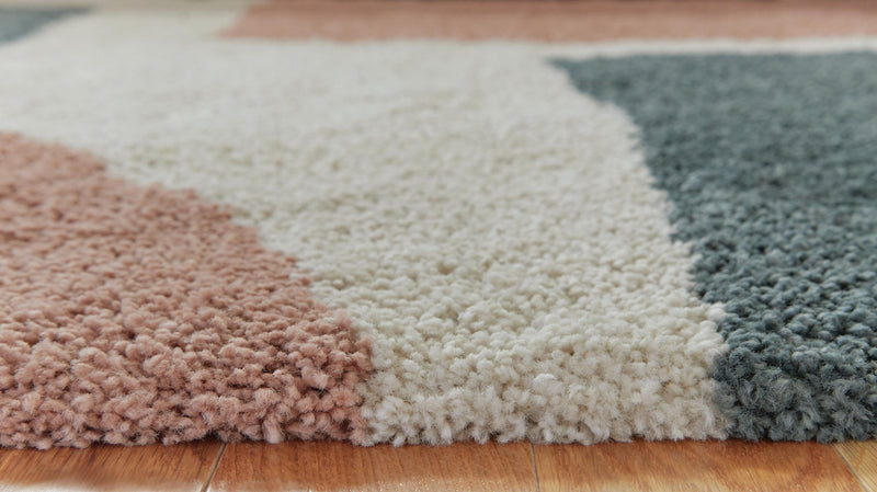 Signature Design by Ashley Flynnwick area rug with geometric pattern in neutral tones, perfect for modern living rooms.