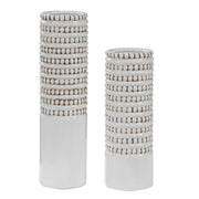 Set of two white Uttermost Angelou vases with smooth, rounded ceramic design perfect for modern home decor.