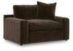 Benchcraft Maxton Heights chair and a half with plush fabric and wide seating, perfect for lounging in a stylish living space.