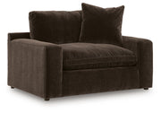 Benchcraft Maxton Heights chair and a half with plush fabric and wide seating, perfect for lounging in a stylish living space.