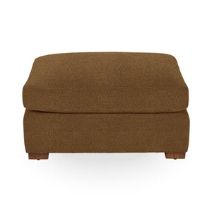 Classic Home Audrey upholstered ottoman with plush fabric and wooden legs, ideal as a versatile footstool or accent piece.