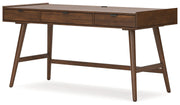 Signature Design by Ashley Lyncott home office desk in a modern style with a spacious wooden surface and sleek metal legs.