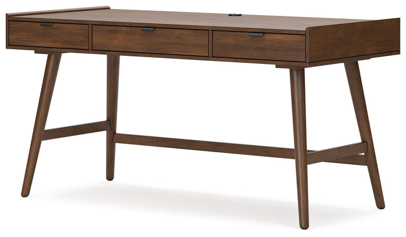 Signature Design by Ashley Lyncott home office desk in a modern style with a spacious wooden surface and sleek metal legs.