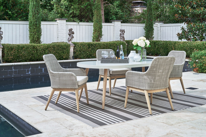 Seton Creek 5-piece outdoor dining set by Signature Design Ashley featuring a table and four chairs in a stylish outdoor setting.