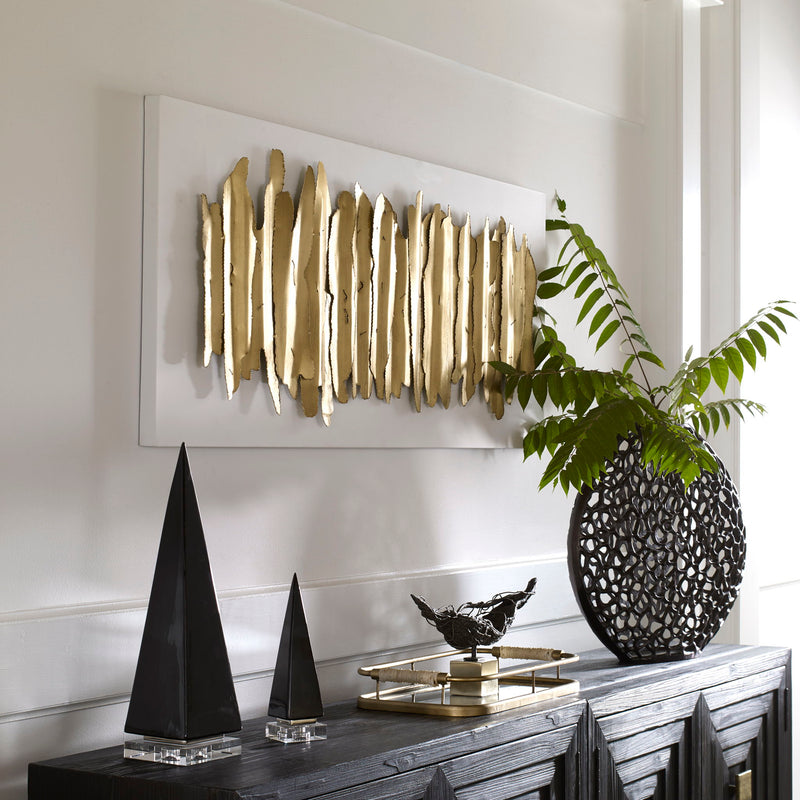 Uttermost Lev metal wall decor featuring white and gold geometric design for modern interior accents