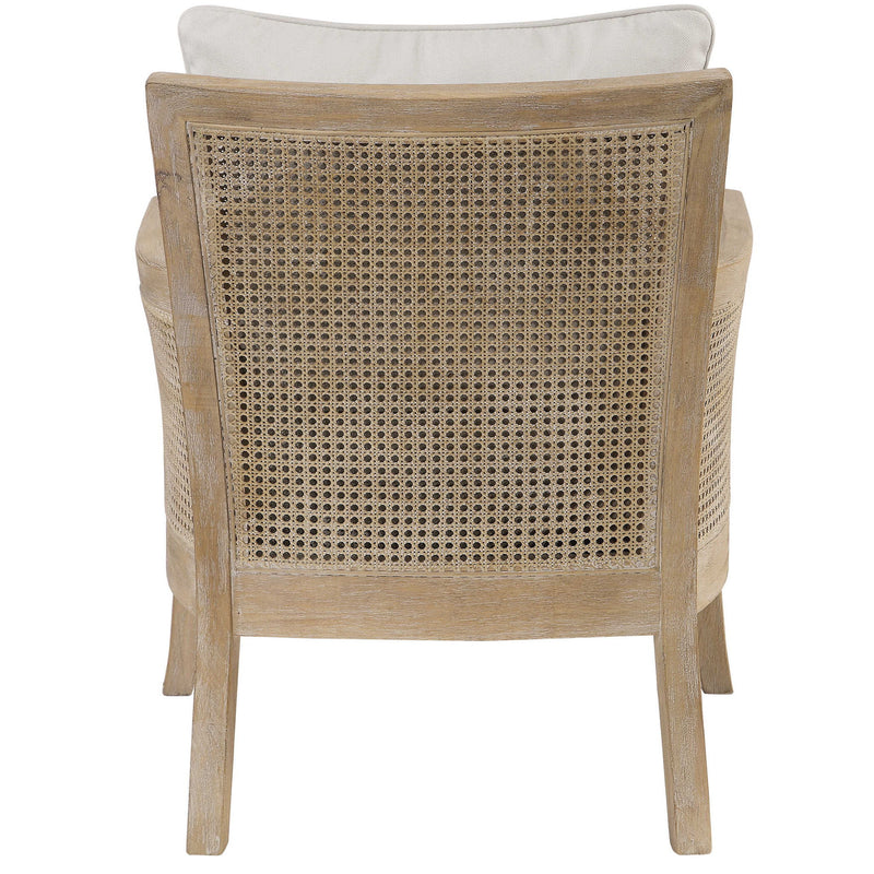 White Uttermost Encore natural armchair with plush cushioning and wooden legs, showcasing a modern, elegant design.