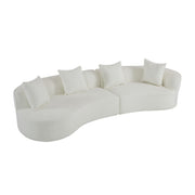 Elegant curved sectional sofa by Noble House with plush foam cushions, showcasing a stylish stationary sofa design in a modern living room.