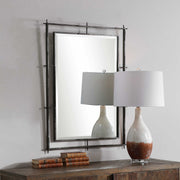 Uttermost Ironworks industrial black wall mirror with a sturdy metal frame and vintage-inspired design.