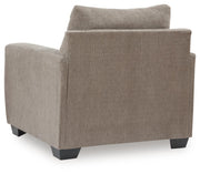 Bencrraft® arm chair with plush upholstery and wooden legs, showcasing a comfortable, stylish seating option.