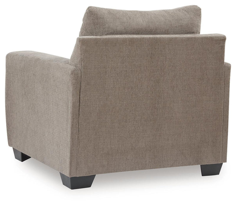 Bencrraft® arm chair with plush upholstery and wooden legs, showcasing a comfortable, stylish seating option.