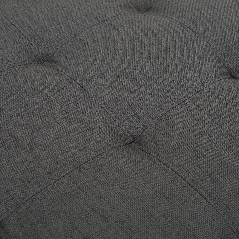 Noble House Isabella contemporary storage ottoman with cushioned top and wooden legs, in a neutral fabric finish.