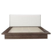 ACME Zoey upholstered bed with a padded headboard and fabric upholstery, shown in a modern bedroom setting.