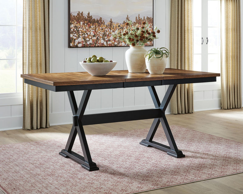 Wildenauer Signature Design by Ashley dining room extension counter table with a sleek wooden surface and sturdy legs.