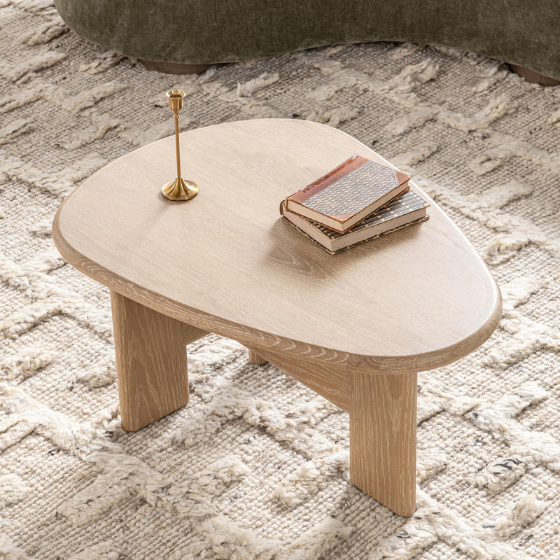 Classic Home Langford coffee table with a sleek wooden surface and modern design, perfect for living room decor.