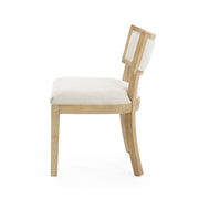 Set of two farmhouse style fabric upholstered Noble House side dining chairs with cushioned seats and wooden legs.