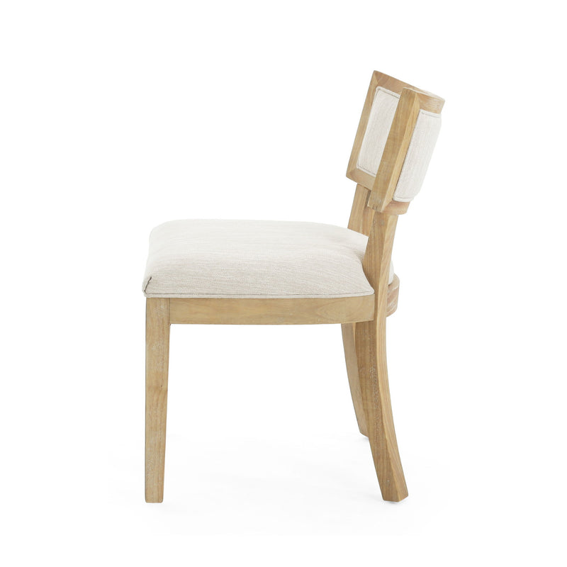 Set of two farmhouse style fabric upholstered Noble House side dining chairs with cushioned seats and wooden legs.