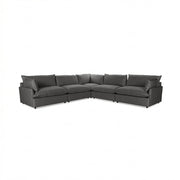 Classic Home Caplan modular sectional sofa with beige fabric upholstery and plush cushions in a modern living room setting.