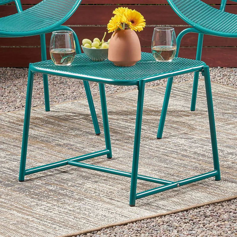 Noble House outdoor iron arm chair with intricate design, sturdy frame, and elegant craftsmanship for patio or garden use.