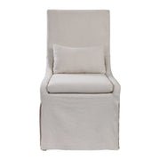Uttermost Coley armless side chair with plush fabric upholstery and modern design, shown in a stylish living room setting.