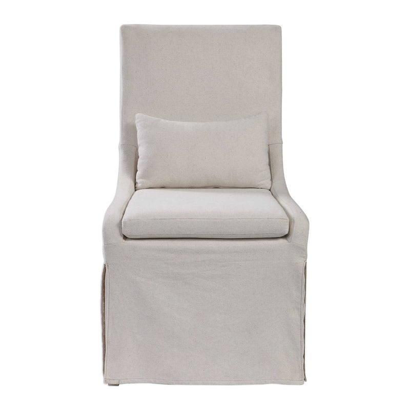 Uttermost Coley armless side chair with plush fabric upholstery and modern design, shown in a stylish living room setting.