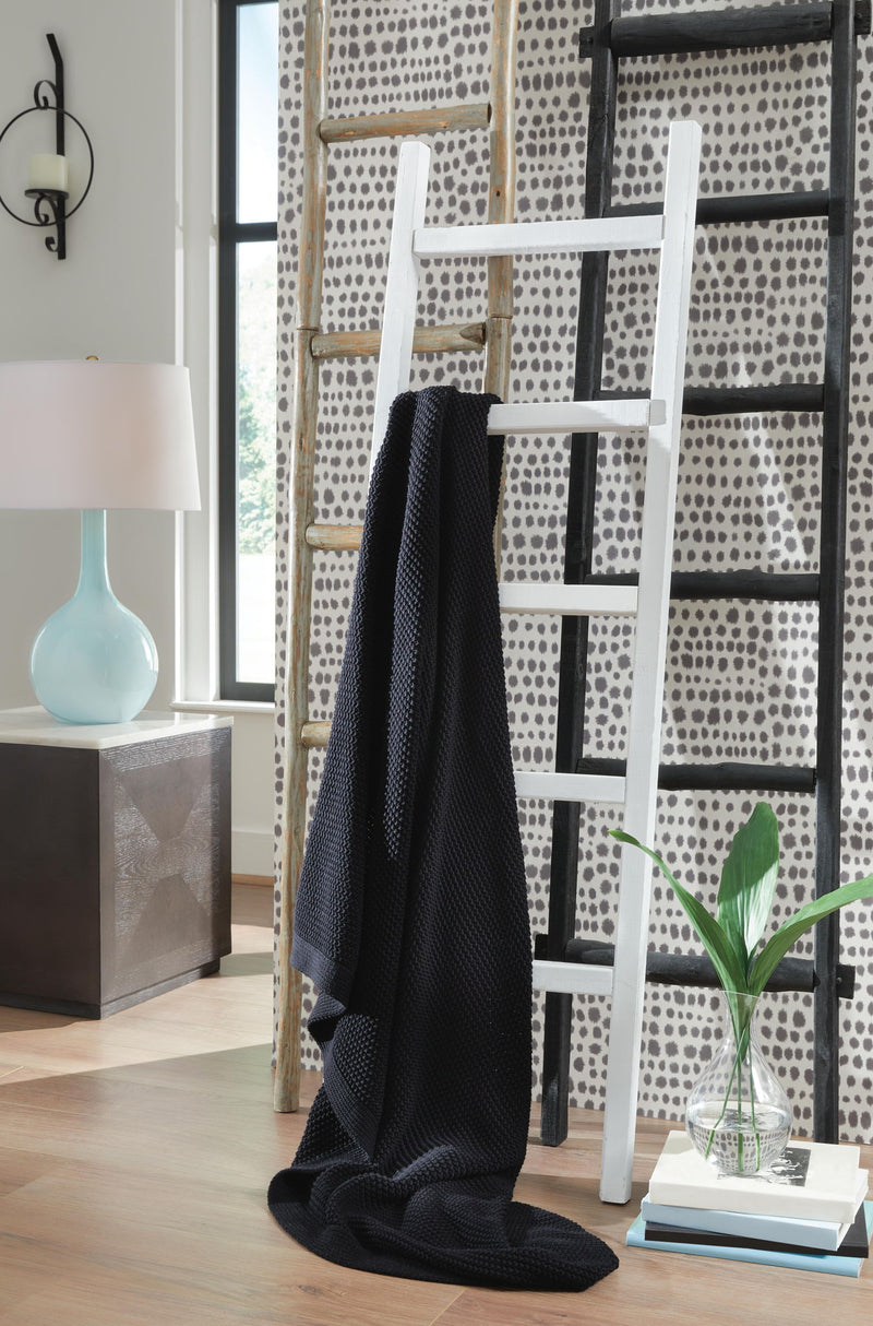 Gayelery throw blanket by Signature Design by Ashley® featuring soft, cozy fabric with a stylish pattern for living room decor.