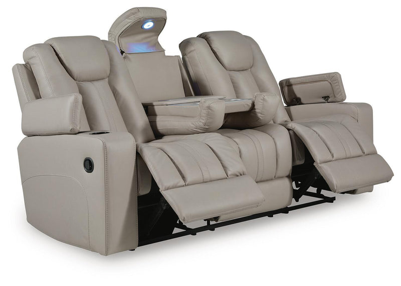 Signature Design by Ashley Elevate Edges reclining sofa with drop-down table in coin upholstery, showcasing plush cushions and built-in features.