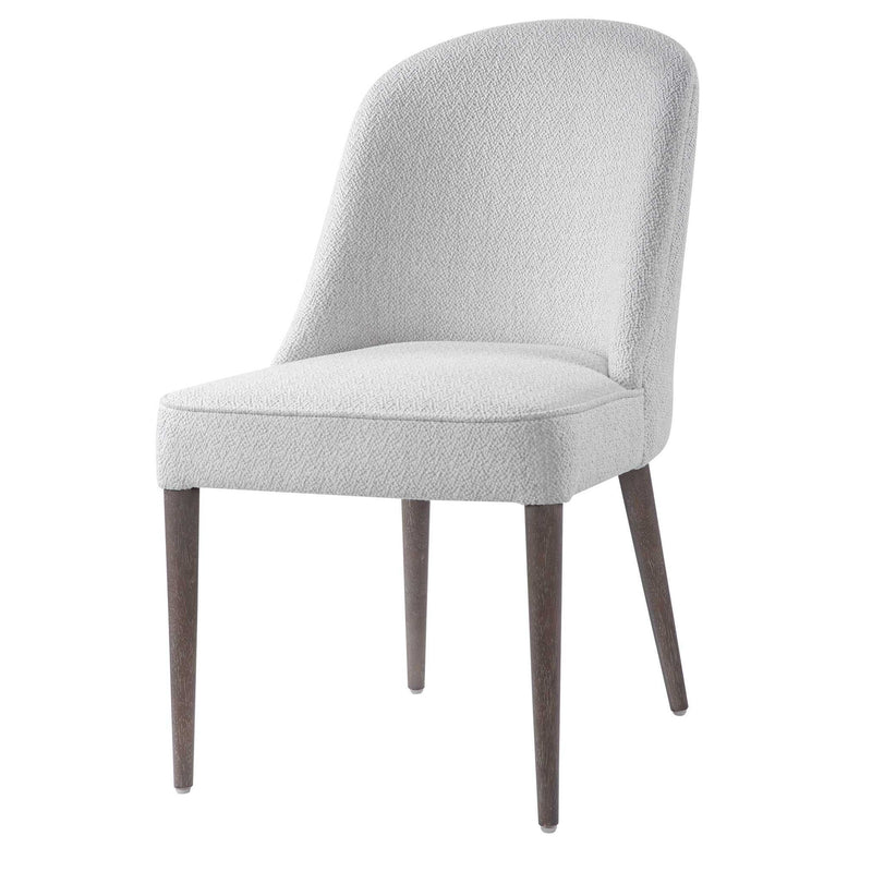 Set of two Uttermost Brie armless chairs with upholstered seats and wooden legs, modern design for stylish living spaces.